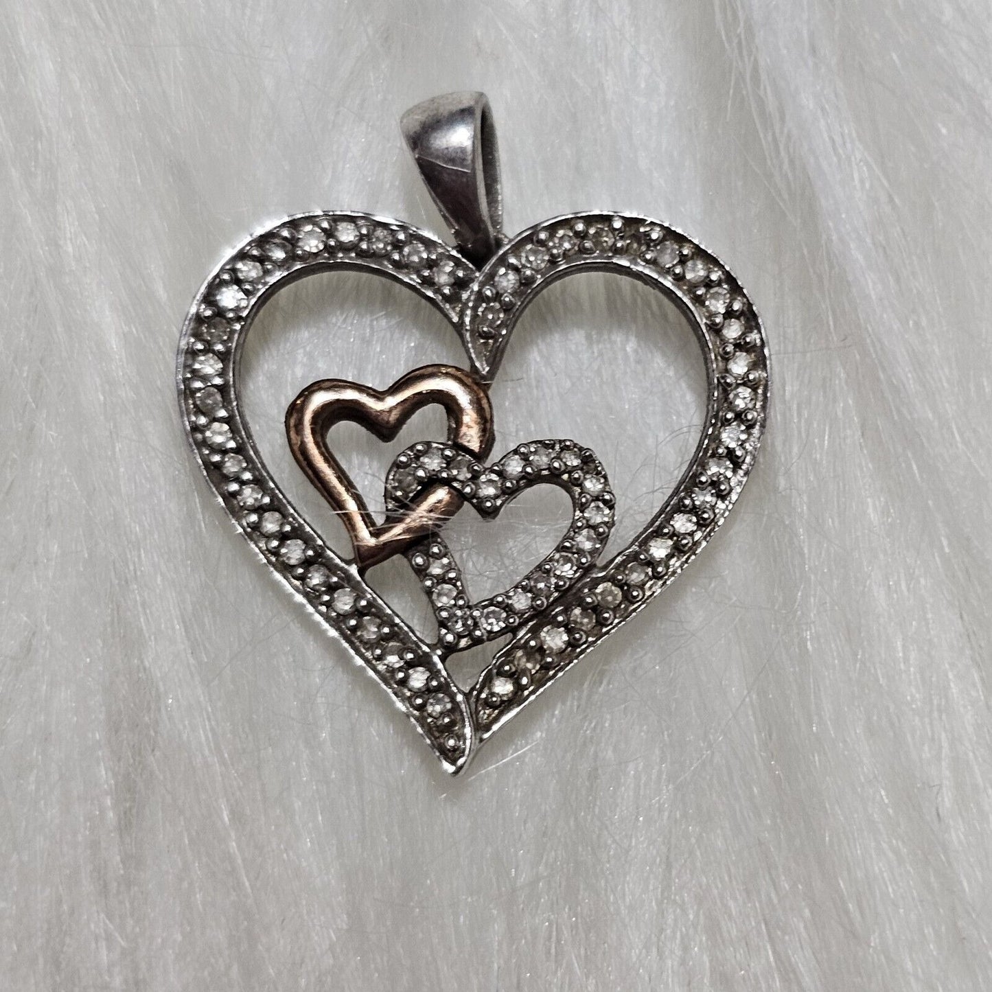 SIGNED SUN STERLING SILVER AND 14 K GOLD AND DIAMONDS HEART PENDANT