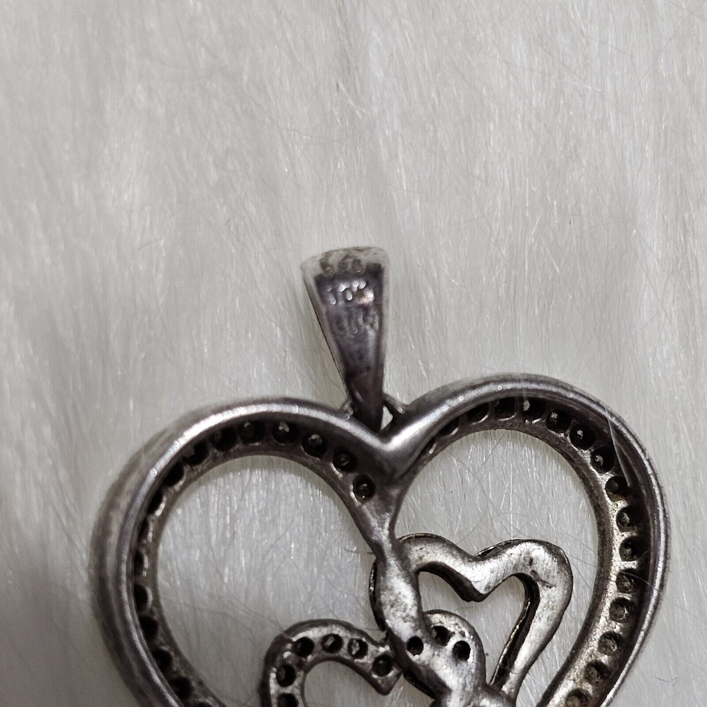 SIGNED SUN STERLING SILVER AND 14 K GOLD AND DIAMONDS HEART PENDANT